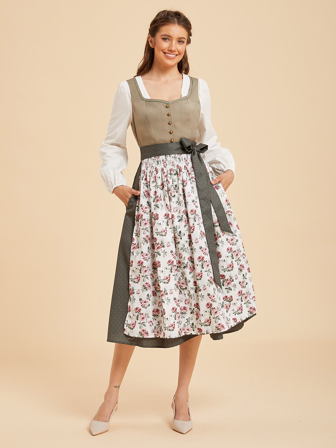 Woman wearing a green and blush RetroRobe Dirndl dress