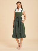 Abito Dirndl verde tinta unita da donna con grembiule lucido e fiocco