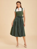 Abito Dirndl verde tinta unita da donna con grembiule lucido e fiocco