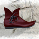 Botines medievales con cordones laterales