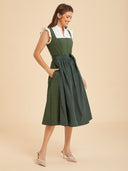 Abito Dirndl verde tinta unita da donna con grembiule lucido e fiocco
